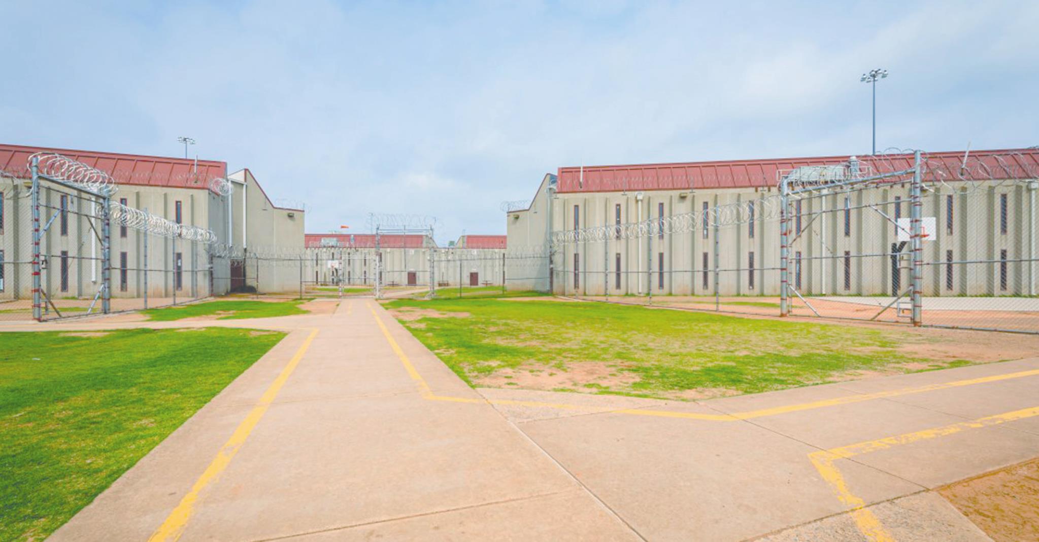 The Oklahoma Board of Corrections unanimously approved two contracts which will keep the North Fork Correctional Facility in Sayre — pictured above — and Davis Correctional Facility in Holdenville open through July 2023. Provided