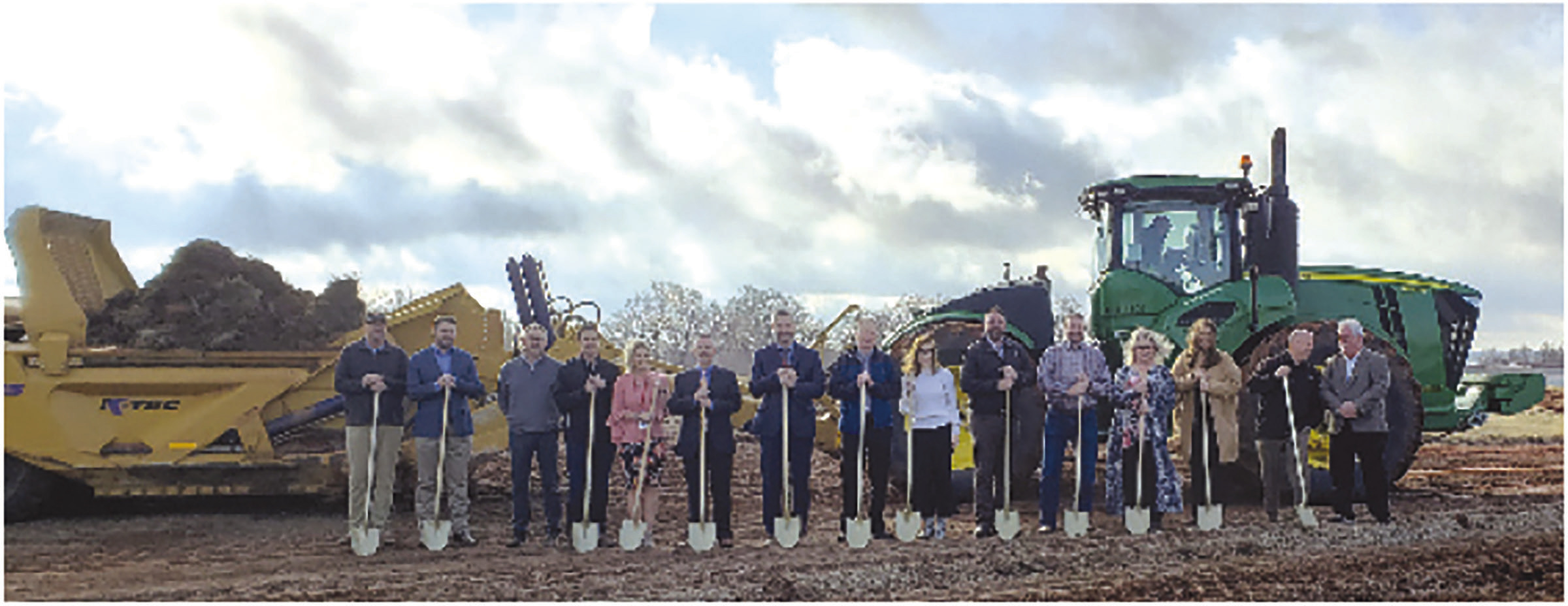 Representatives from Weatherford Public Schools, the City of Weatherford and Joe D. Hall Gen. Contractors, LLC. battle the wind to celebrate the ground breaking of the new West Elementary site Monday morning, which is the former site of the WPS transportation building.