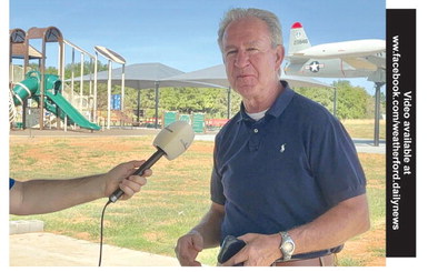 Weatherford Mayor Mike Brown speaks about future plans in the City of Weatherford while standing near the newest park, Shooting Star Park at the Stafford Air and Space Museum. Kyra HuckabayAA/DN