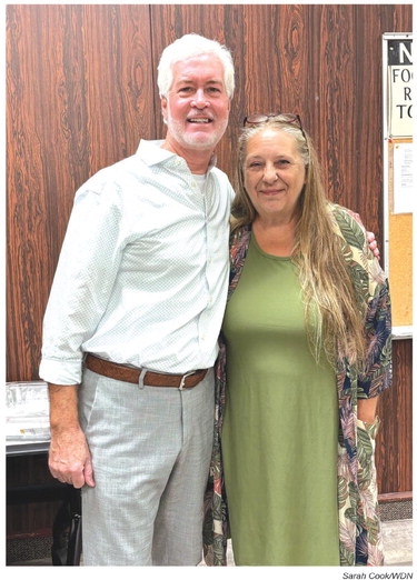 Weatherford Daily News Publisher Phillip Reid, left, wishes City Inspector Joy McKillip, well during her retirement reception Friday at City Hall. Sarah Cook/WDN